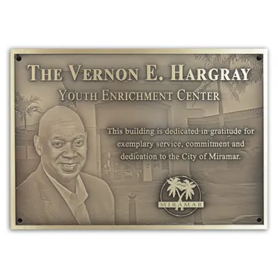 Building dedication plaque at an unveiling ceremony