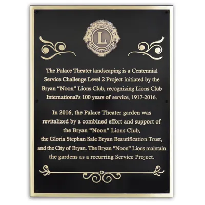 Traditional cast bronze dedication plaque with textured background