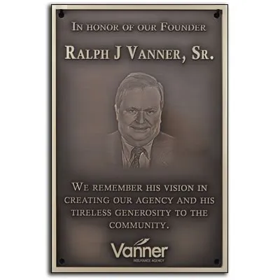 Bronze plaque honoring a company founder with photo and logo