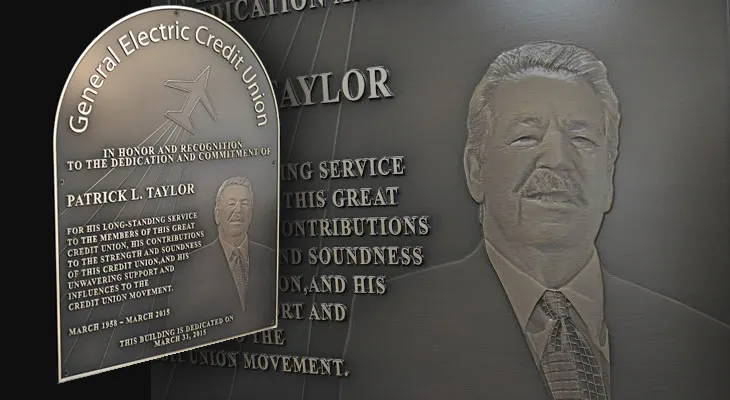 Curved-top bronze credit union dedication plaque with engraved photo and raised logo background