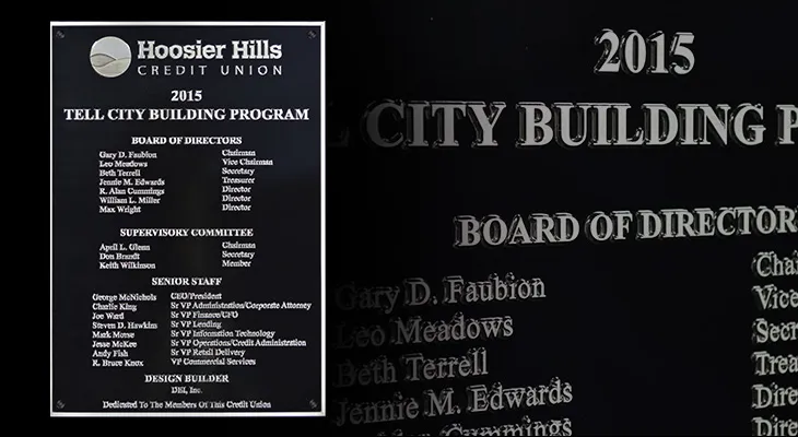 Aluminum credit union dedication plaque listing the board of directors