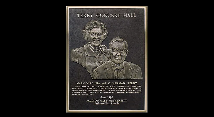 Double bas relief plaque with hand-sculpted portraits of two benefactors