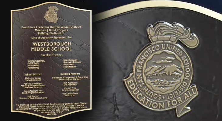 Cast bronze school plaque with textured background and custom lettering