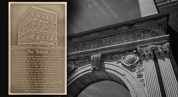 Portrait-shaped bronze oxide historic preservation plaque with an engraved photo and building history