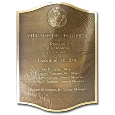 Curved bronze plaque with raised logo and photo texture background
