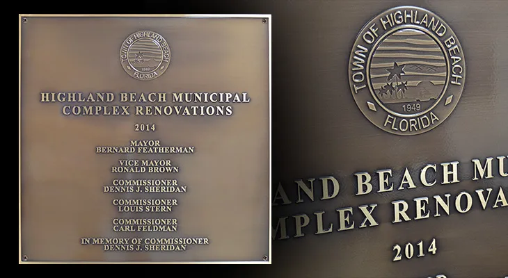 Bronze oxide renovation plaque listing civic leaders with an engraved town seal